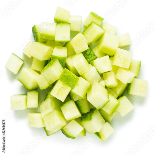 Tablou pe pânză top view of pile vegetable of cucumber diced for salad isolated on white backgro