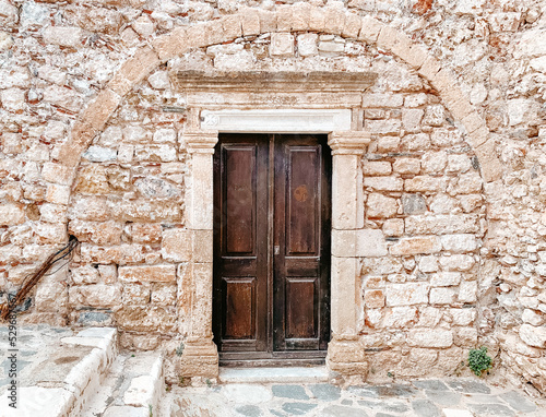 Wooden doorway to stone building in Monemvasia  Greece