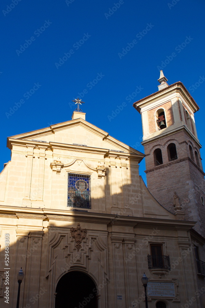 Nice facade with tower and bell tower of the church of Saint Peter in Murcia