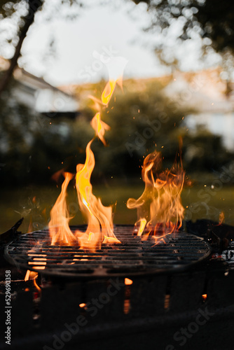 Barbecue grill with fire outdoors. fiery flame