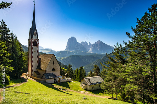 Church of St. James on a beautiful summer day in Val Gardena, South Tyrol, Italy photo