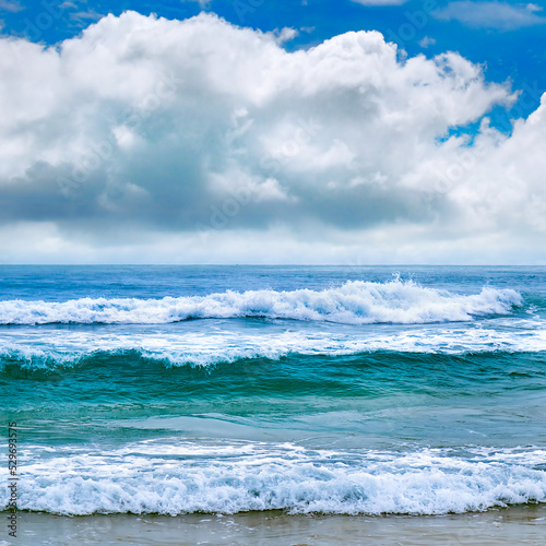 Tropical beach with high waves for surfing.