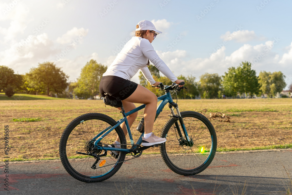 Girl taking a ride on her bike on a sunny day. High quality photo