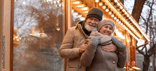 Happy mature couple outdoors on winter day