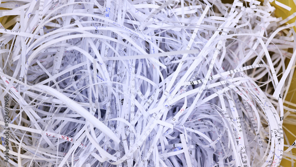 Close up Shredder paper, scrap and reuse paper from shredder machine Close up Shredder paper, scrap and reuse paper from shredder machine