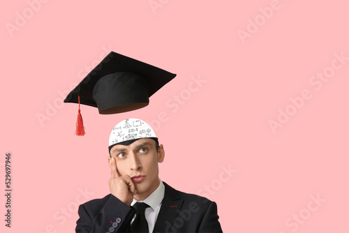 Smart man with graduation h...