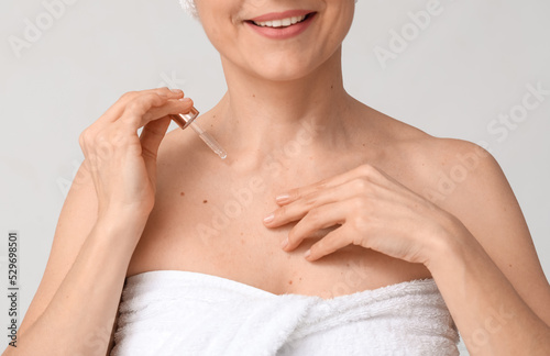 Mature woman with cosmetic ...