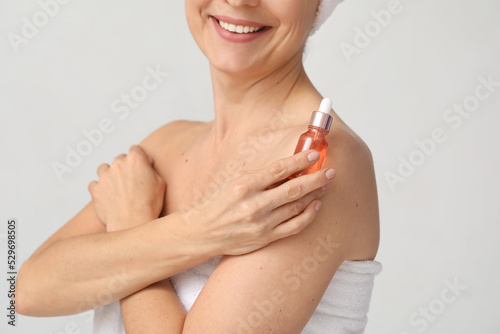 Mature woman with cosmetic ...