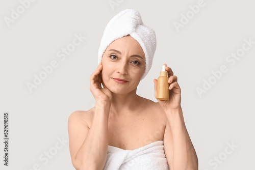 Mature woman with cosmetic ...