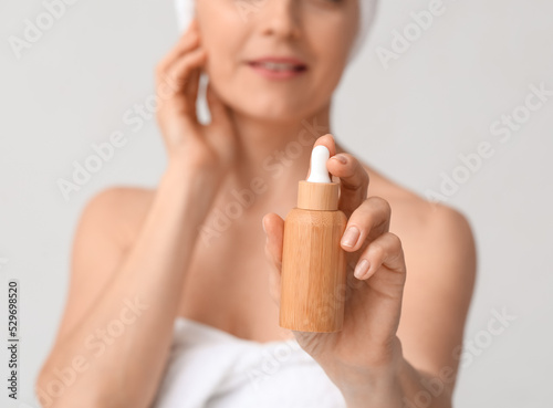 Mature woman with cosmetic ...