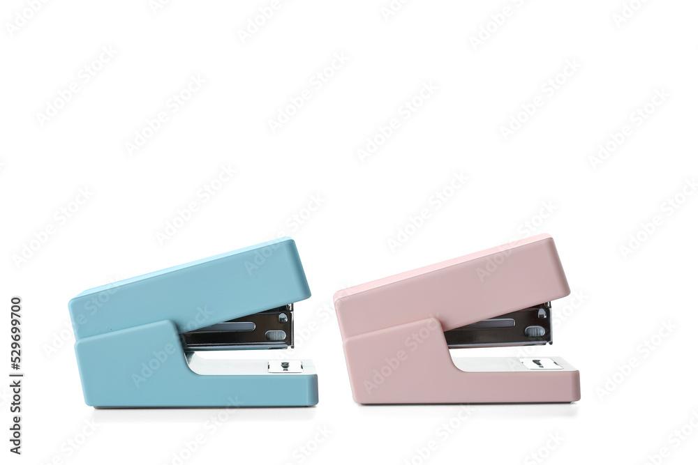 Two staplers on white background
