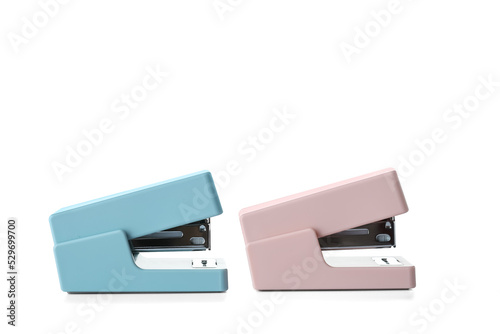 Two staplers on white background