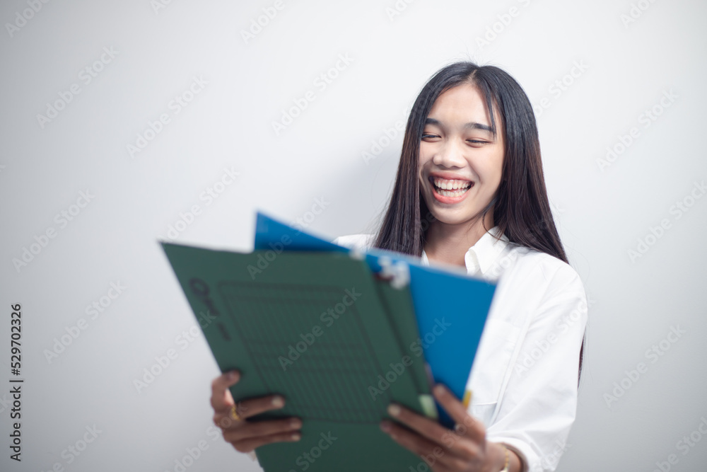 Businesswoman working monthly business investment summary in conference file folder
Businesswoman working monthly business investment summary in conference file folder