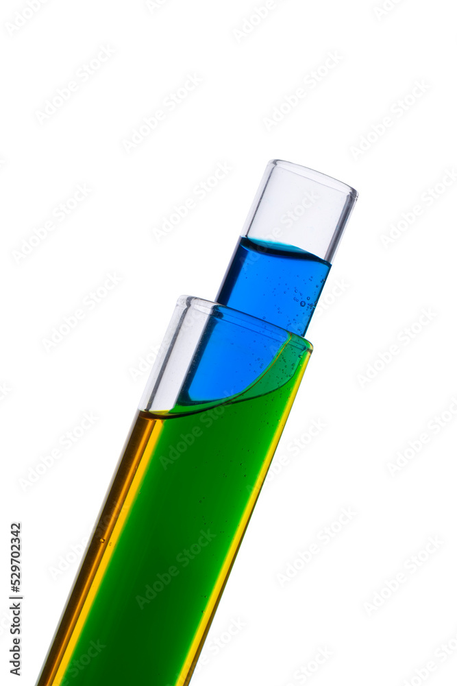 Blue and yellow food coloring in two test tubes