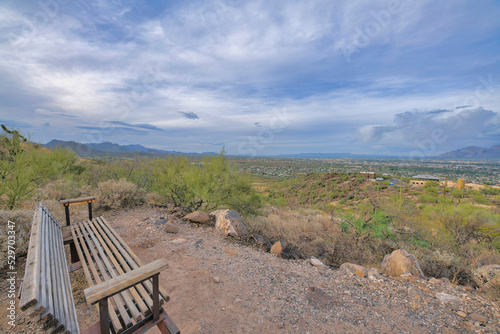 Long wooden bench with overlooking view of Tucson, Arizona landscape