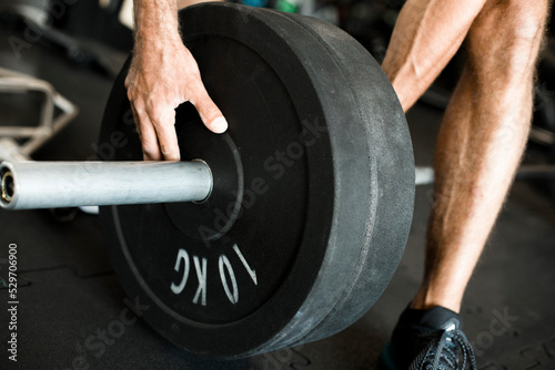 male athlete and athlete prepares barbell for exercises, barbell 15 kg, bodybuilding and competitions, athletes, athletes