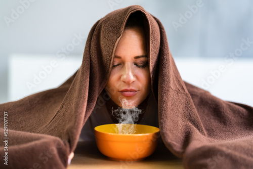 Woman Doing Inhalation Alternative Herbal Medicine photo
