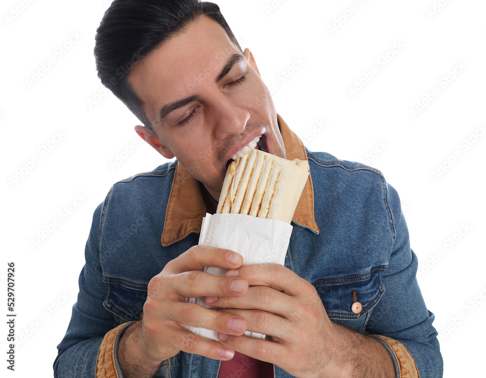 Man eating delicious shawarma on white background Man eating delicious shawarma on white background