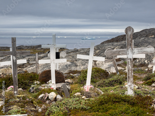 A cemetery at the mouth of the Icefjord glacier (Sermeq Kujalleq), one of the fastest and most active glaciers in the world. A UNESCO world heritage site, Disko Bay, Ilulissat, Greenland