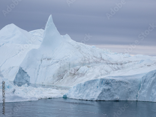 Awe-inspiring icy landscapes at the mouth of the Icefjord glacier (Sermeq Kujalleq), one of the fastest and most active glaciers in the world. A UNESCO world heritage site, Ilulissat, Greenland 