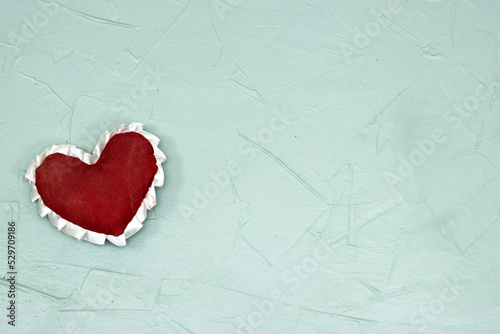 red heart on grunge green background  health care  love  organ donation  mindfulness  wellbeing  family insurance and CSR concept  world heart day  world health day  National Organ Donor Day