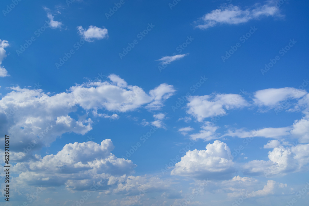 Blue sky with fluffy clouds as a tranquil background Blue sky with fluffy clouds as a tranquil background
