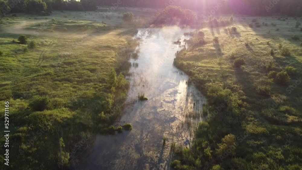 Aerial view on bog lake in foggy morning at sunrise aerial. Drone video. Aerial view on bog lake in foggy morning at sunrise aerial. Drone video.
