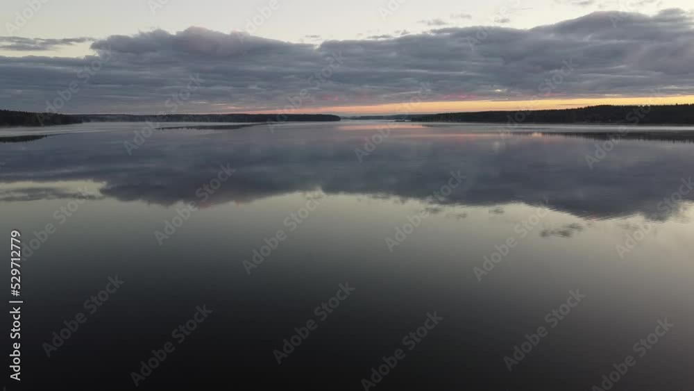 Flying over foggy lake early morning at sunrise. Drone video. Flying over foggy lake early morning at sunrise. Drone video.