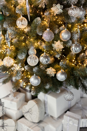 White gift boxes under Christmas tree