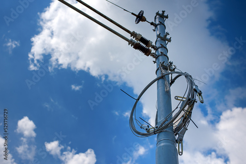 Overhead line under construction. It is used to transmit electrical energy to electric trains, trolleybuses or trams. It is known as overhead catenary, overhead contact system or traction wire.
