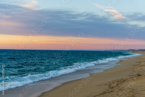 Fototapeta Naklejka Na Ścianę i Meble -  Evening on the beach by the ocean