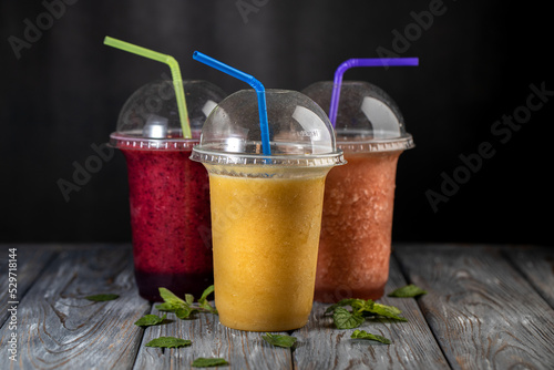 Fresh fruit smoothies on a dark background. Non alcoholic beverages