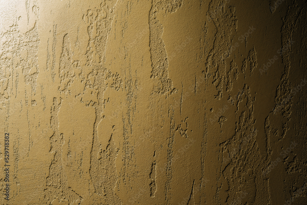 Fototapeta premium Venetian golden plaster background. Mock up of textured wall