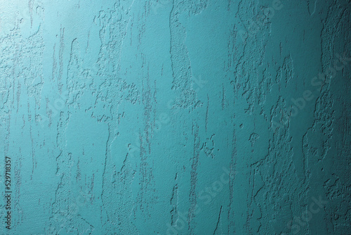 Cyan background of plaster wall. Gradient plaster wallpaper