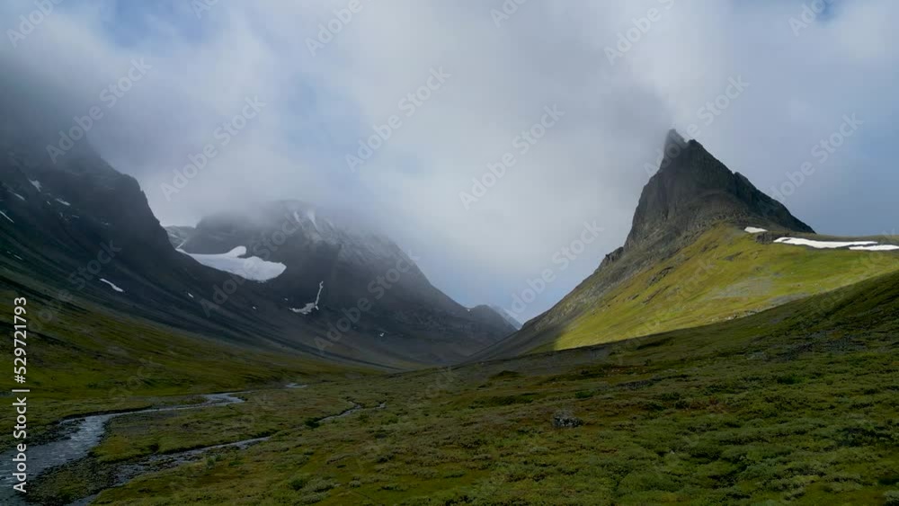 Drone footage of the Nallo mountain, glaciers, and mountain streams near Kungsleden hiking trail, Lapland, Sweden