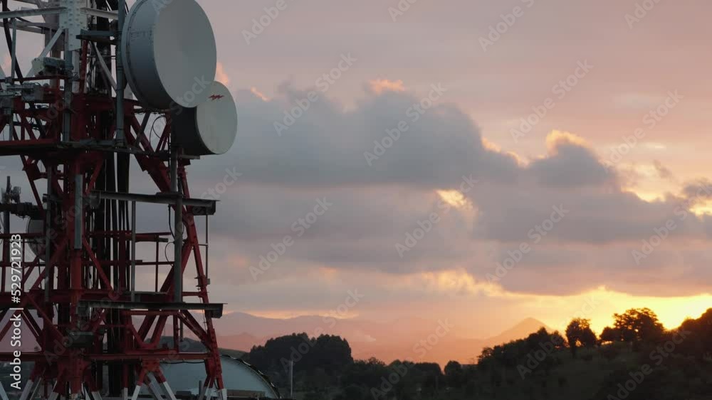 High broadcast tower with antennas in Bilbao at sunset