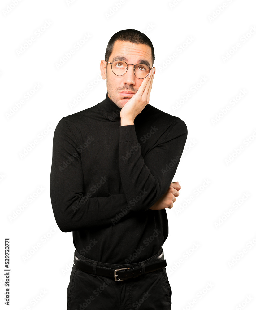 Relaxed young man making a gesture of sleep Relaxed young man making a gesture of sleep