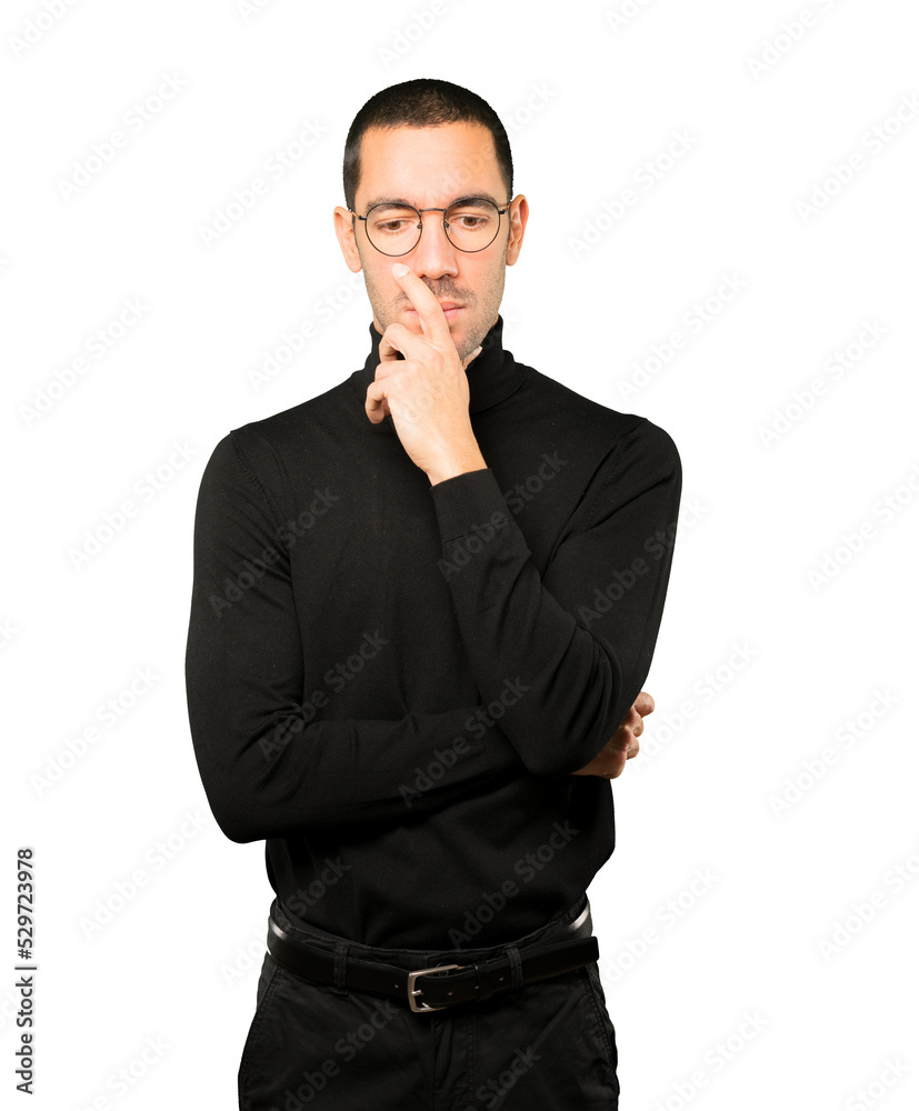 Concerned young man posing against background Concerned young man posing against background
