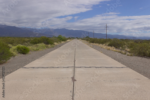 Road without cars in a beautiful scenery on a cloudy day.
