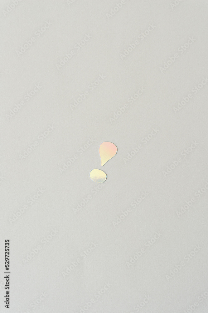 small exclamation mark isolated on blank paper