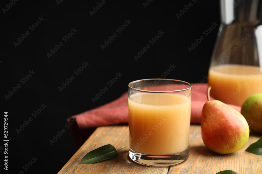 Fresh pear juice in glass and fruits on wooden table. Space for text Fresh pear juice in glass and fruits on wooden table. Space for text