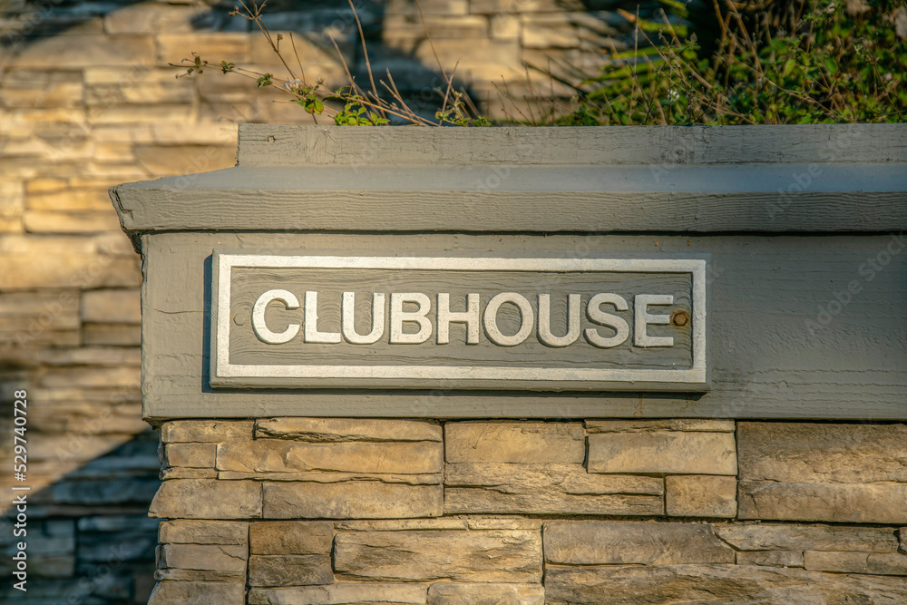 Fototapeta premium La Jolla, California- Clubhouse label on a wall outside with stones