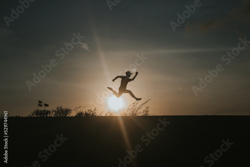 silhouette of jumping person