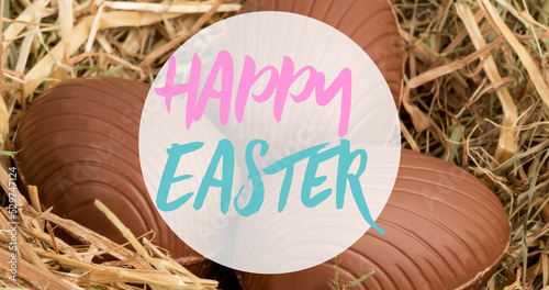 Image of happy easter text over chocolate eggs