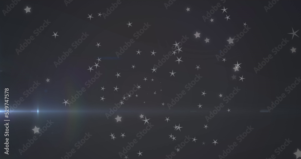 Fototapeta premium Image of glowing blue light moving over stars in background