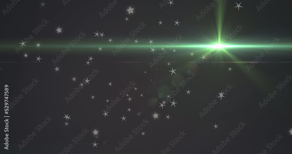 Naklejka premium Image of glowing green light moving over stars in background