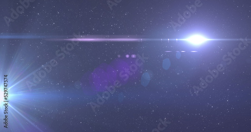 Fototapeta Naklejka Na Ścianę i Meble -  Image of glowing blue light moving over spots of light and stars in background