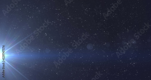 Image of glowing blue light moving over spots of light and stars in background