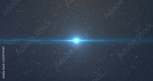 Image of glowing blue and orange light moving over spots of light and stars in background