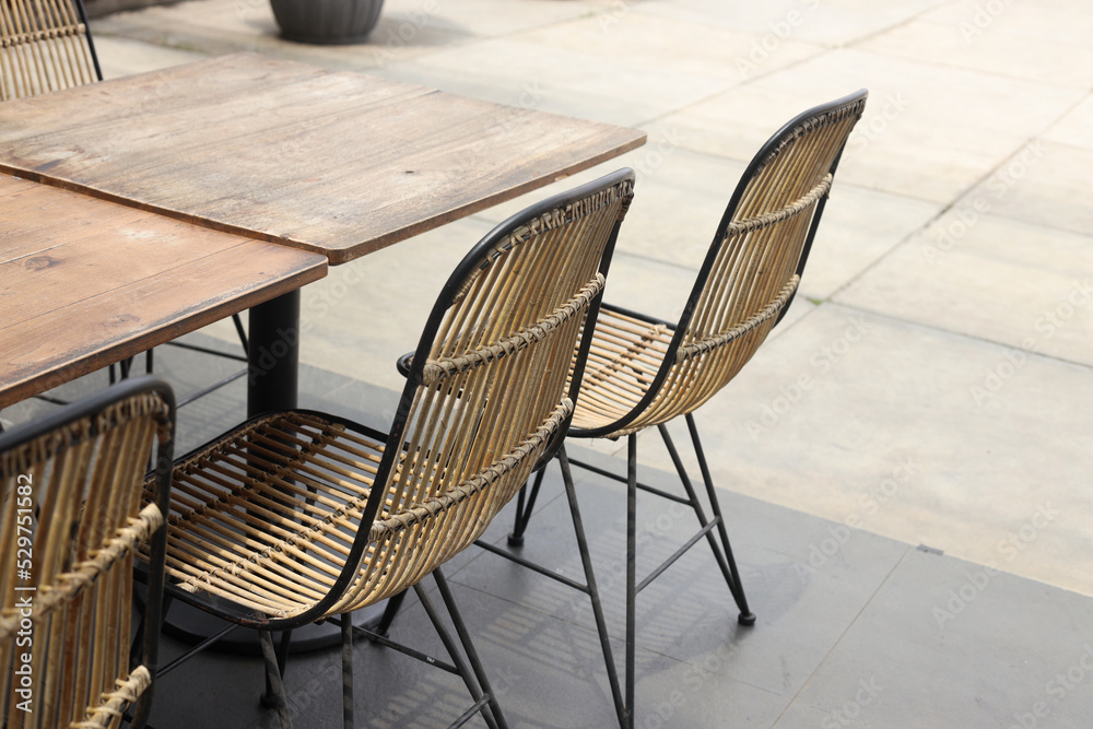 Wooden chairs and table in cafeteria terrace. Wooden chairs and table in cafeteria terrace.